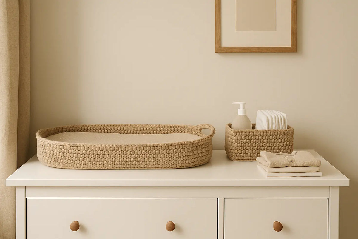 Organised nursery changing station with a changing basket, changing mat and nappy caddy.