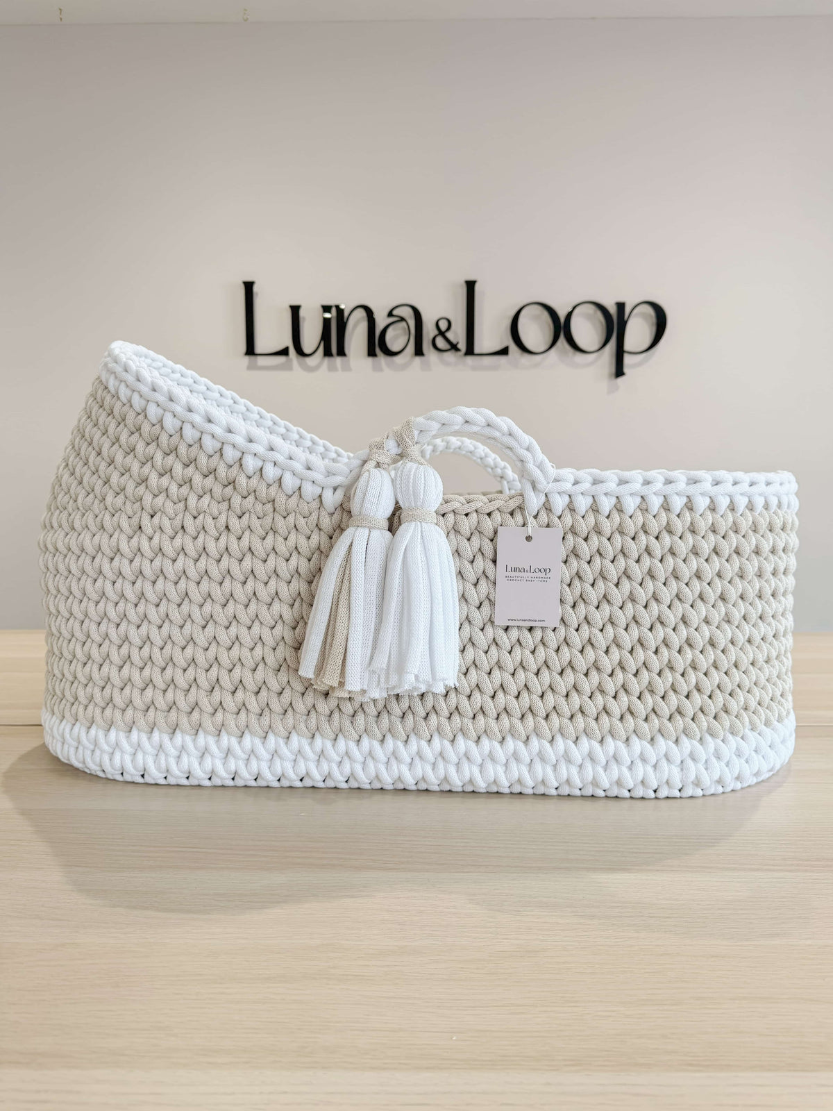 Handmade hooded crochet Moses basket in beige and white with twin tassels